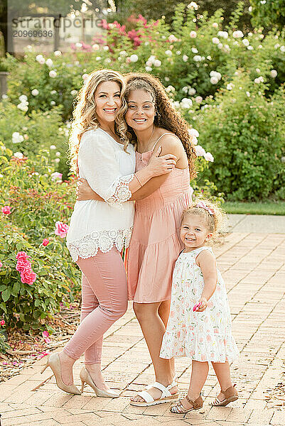 Mother with daughters in garden