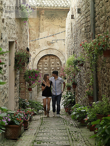 Young Italian couples enjoying each other's company in the city of Spello  Italy.