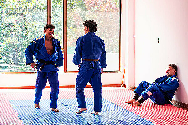 Happy judo fighters in judo training in dojo