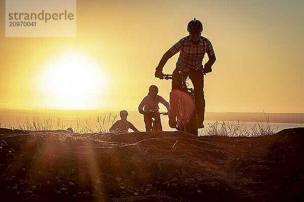 People riding bicycles at sunrise  Duluth  Minnesota  USA