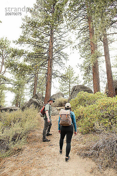 Hiker couple walking up a trail together