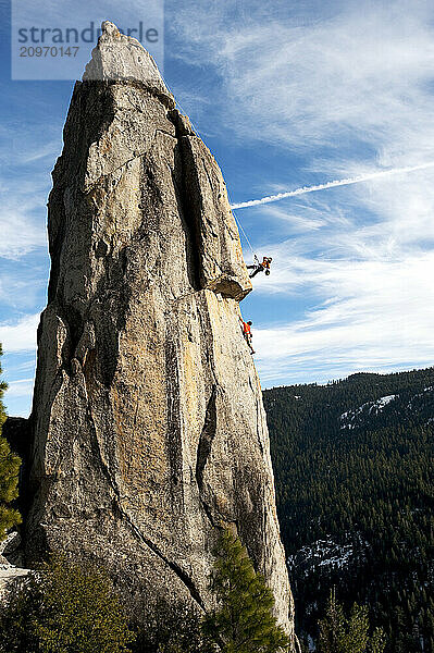 A photographer photographs a rock climber in Calif.