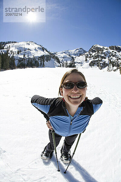 Young woman snowshoeing near Lake Tahoe  California.