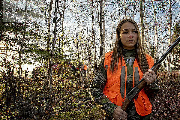 Portrait of young woman out hunting  Biwabik  Minnesota  USA