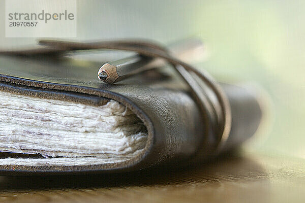 Still life of journal and pencil.