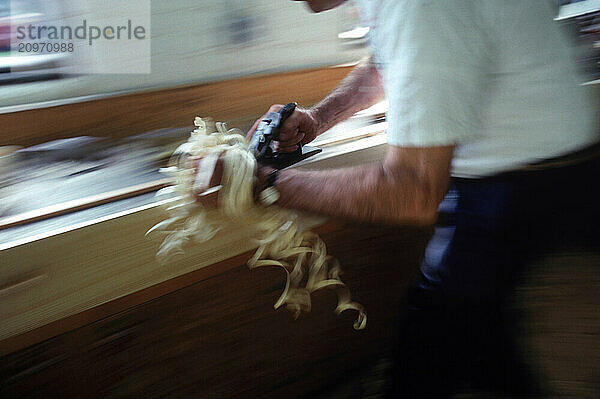 Planing wood (motion blur)