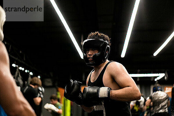 Boxers fighting in boxing training in the gym.