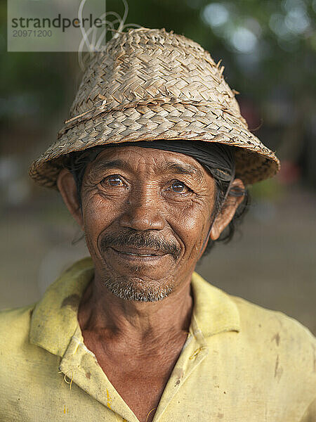 An elderly fisherman at sunset in Bali  Indonesia.