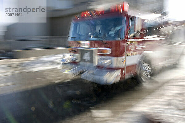 A fire truck rolls down the street of Portland  Maine.