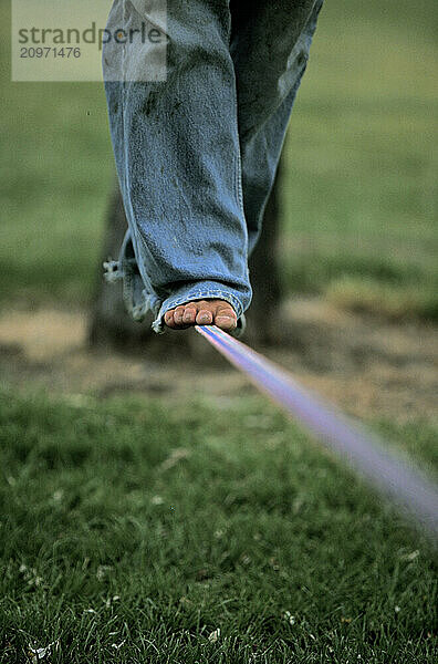 Young person walking on slackline in Bishop  CA