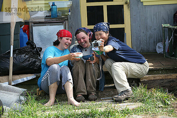 Project Puffin researchers Liz Zinsser  and Maki Briggs  and Juliet Lambs Project Puffin on Eastern Egg Rock Island  Maine.