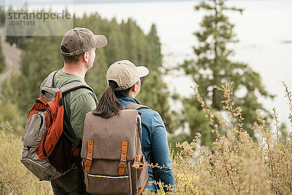 Hiker couple looking out at the view together