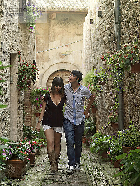 Young Italian couples enjoying each other's company in the city of Spello  Italy.