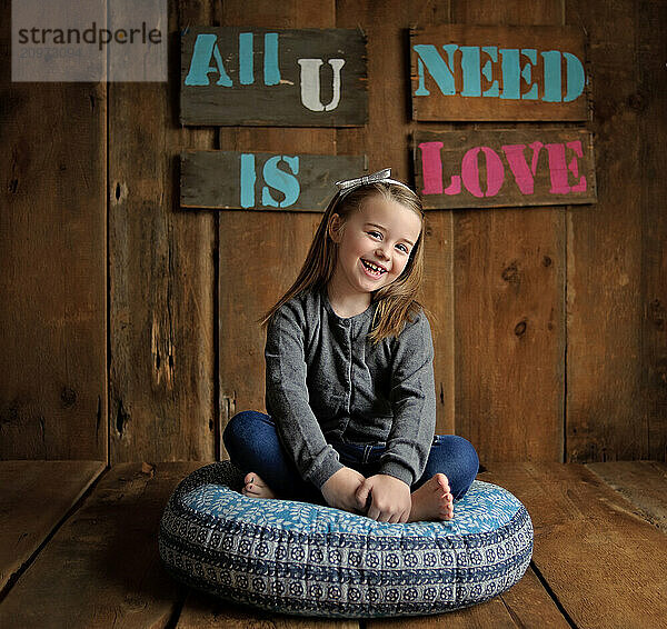 Beautiful young posing on beanbag chair