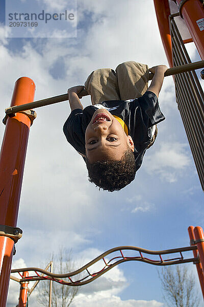 Young boy playing in playground in Sacramento  CA.