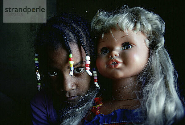 A girl plays with a doll in the Liberty City section of Miami  Florida.