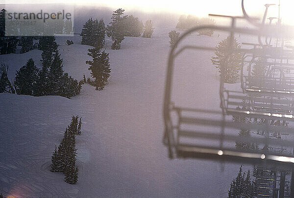 Ski lift in storm at ski resort  California.