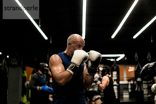 Boxers fighting in boxing training in the gym.