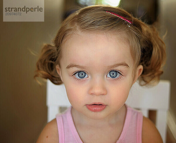 Close up beautiful toddle big blue eyes