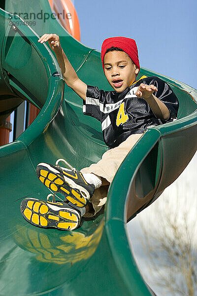 Young boy playing in playground in Sacramento  CA.