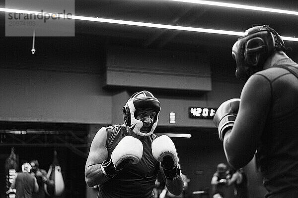 Boxers fighting in boxing training in the gym.