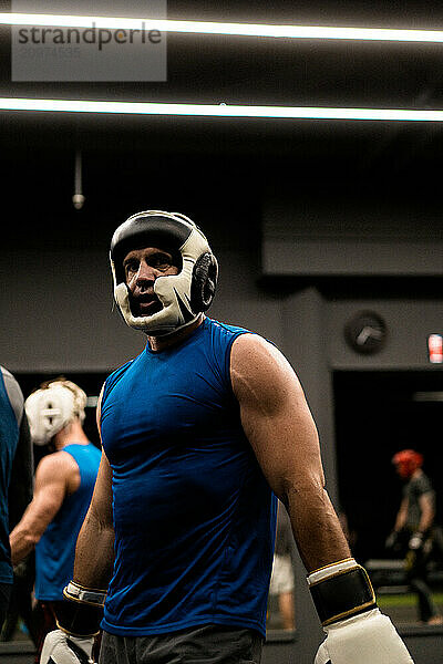 Boxers fighting in boxing training in the gym.