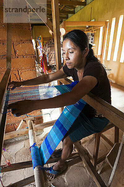 Woman Weaving On A Traditional Hand Loom In Copan  Honduras