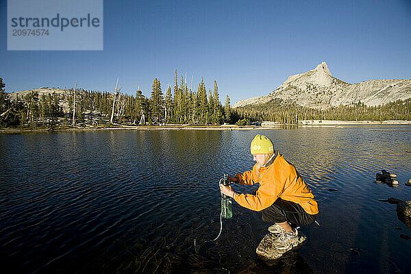 A woman backpacking in Yosemite National Park  California.