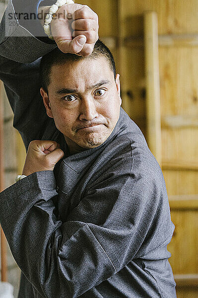 Shaolin Monk Shi De Jian demonstrates traditional martial arts at the San Huang Zhai Monastery on the Song Mountain  China.