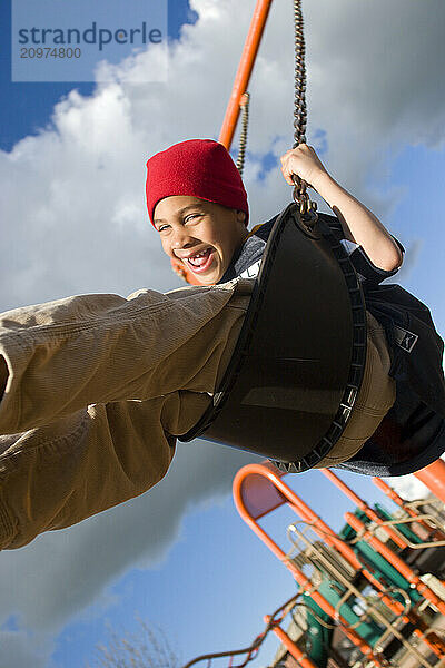 Young boy playing in playground in Sacramento  CA.