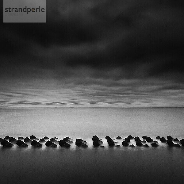 Tetrapods in the sea and dramatic sky  Shizuoka Prefecture  Japan