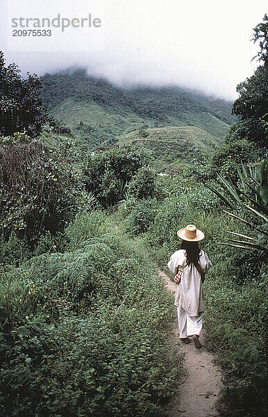 Kogi Indian walks a trail  Colombia.