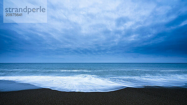 Sea waves and dramatic sky at the beach  Aichi Prefecture  Japan