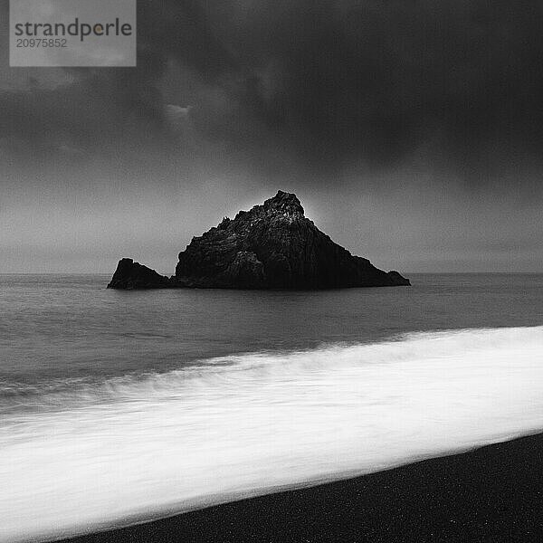 Sea stack at the beach and dramatic sky  Aichi Prefecture  Japan