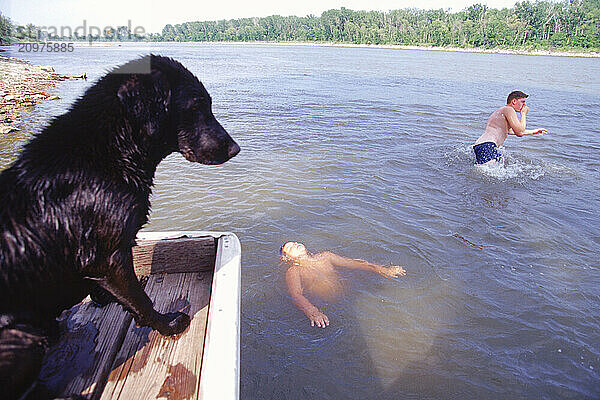 People swiming in a river.