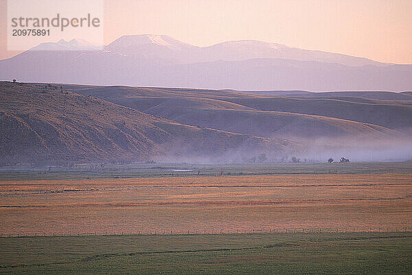 A farm at sunrise.