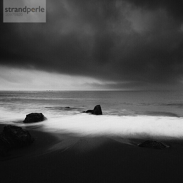 Sea stacks at the beach and dramatic sky  Aichi Prefecture  Japan