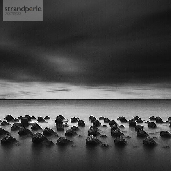 Tetrapods in the sea and dramatic sky  Shizuoka Prefecture  Japan