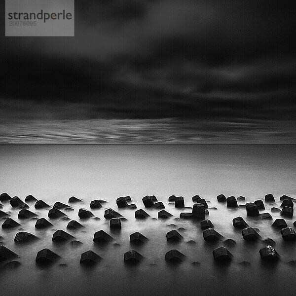 Tetrapods in the sea and dramatic sky  Shizuoka Prefecture  Japan