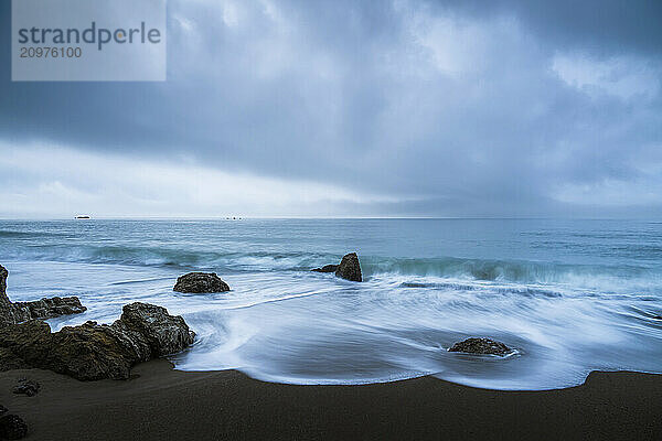 Sea stacks at the beach and dramatic sky  Aichi Prefecture  Japan