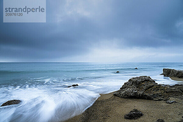 Sea stacks at the beach and dramatic sky  Aichi Prefecture  Japan