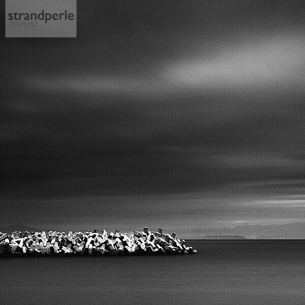 Dramatic sky and tetrapods in the sea  Jogashima Island  Japan