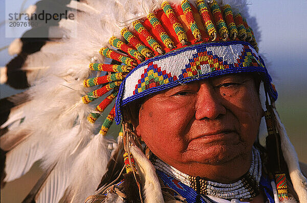 Native American chief in headress.