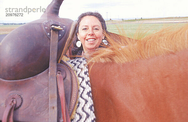 A woman and a horse.