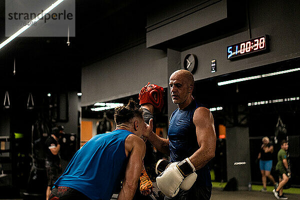 Boxers fighting in boxing training in the gym.