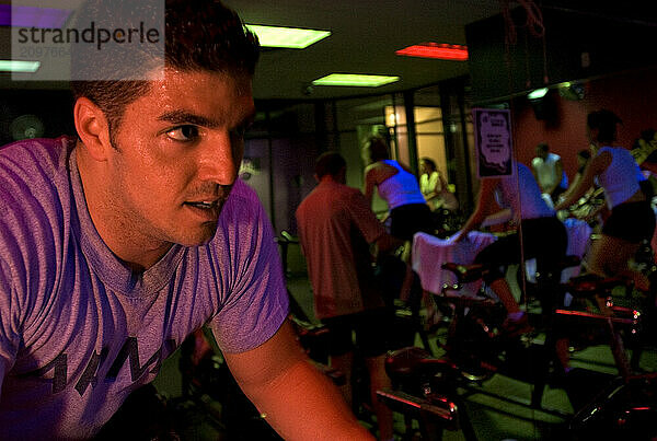 A man works up a sweat in spinning class