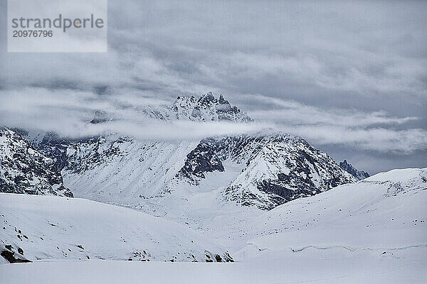 View Of A Stauning Alps Shrouded In A Clouds