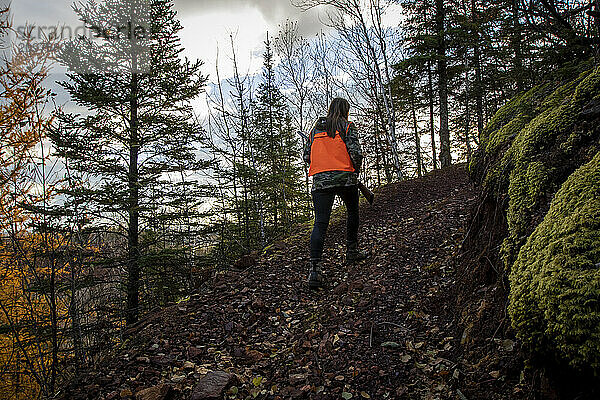 Portrait of young woman out hunting  Biwabik  Minnesota  USA