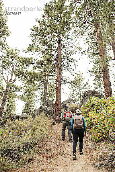 Couple walking outdoors together on a trail