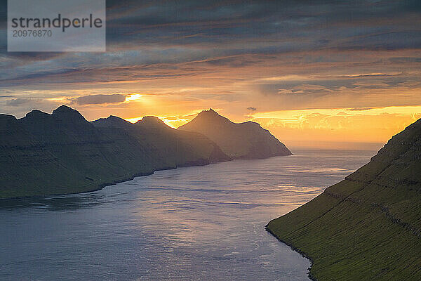 Scenic view of mountains and fjord at sunset  Klaksvik  Kalsoyarfjordur  Faroe Islands